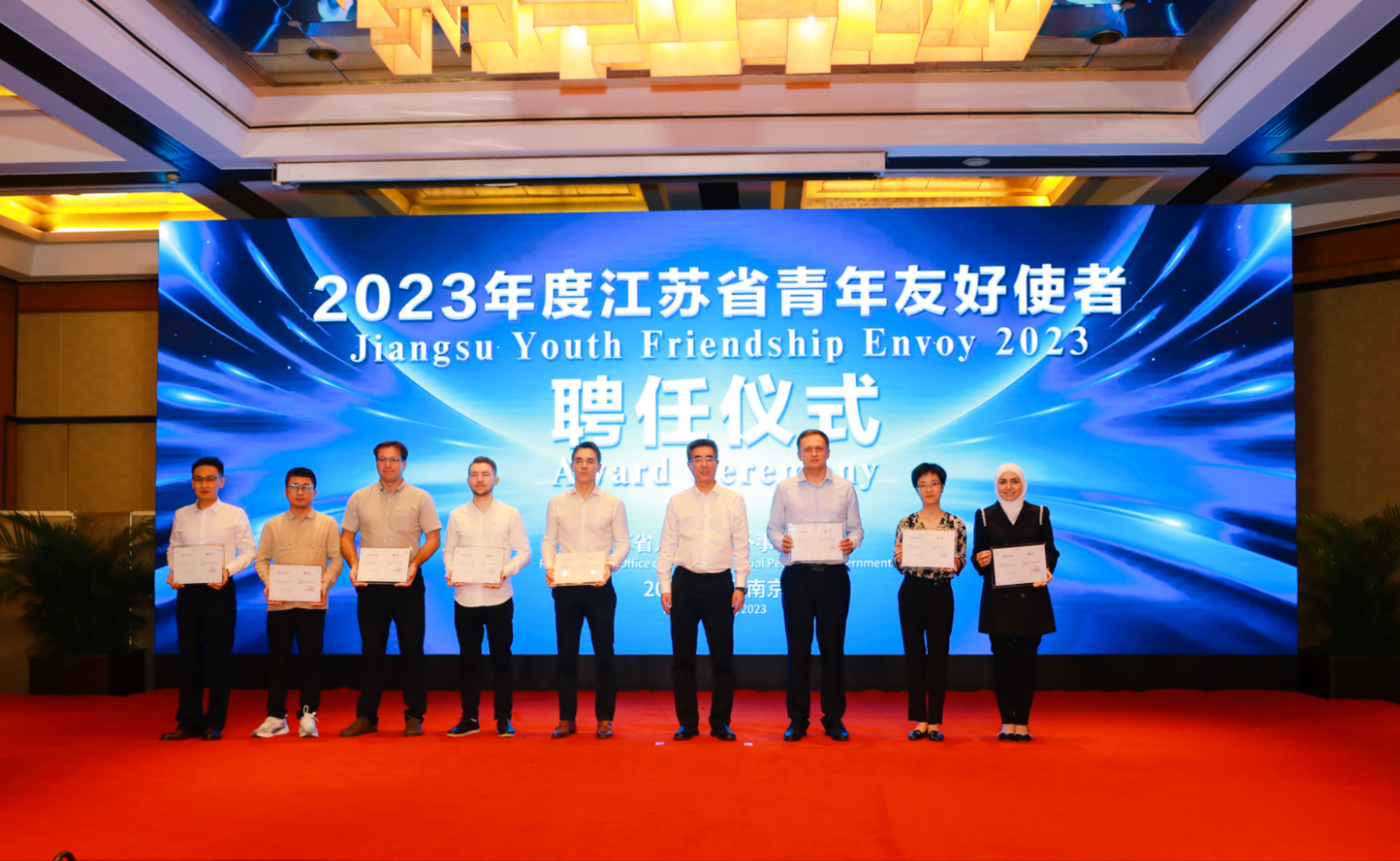 Viktor Lopata can be seen holding his award. He is the 4th person from the left.