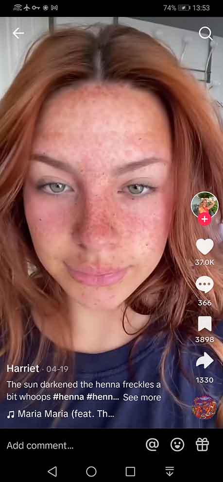 A video of a woman showcasing the famous faux freckles look on TikTok